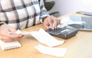 woman-pressing-calculator-calculate